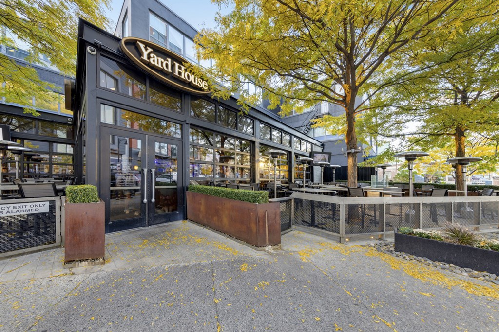 The image shows the front of Yard House restaurant with a black and white exterior.