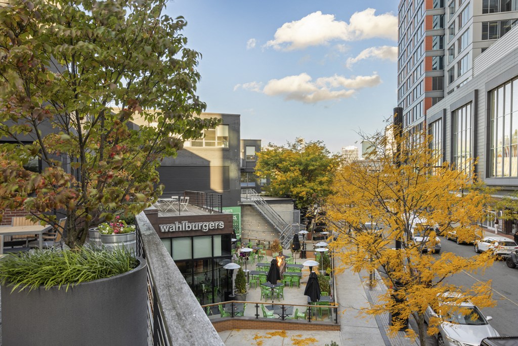 A view of a city street with a Wahls burgers sign.