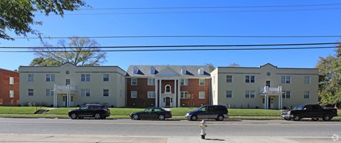an image of an apartment building on a city street
