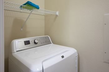 Laundry Room at Skye at Arbor Lakes Apartments in Maple Grove, MN