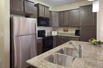 Kitchen at Skye at Arbor Lakes Apartments in Maple Grove, MN