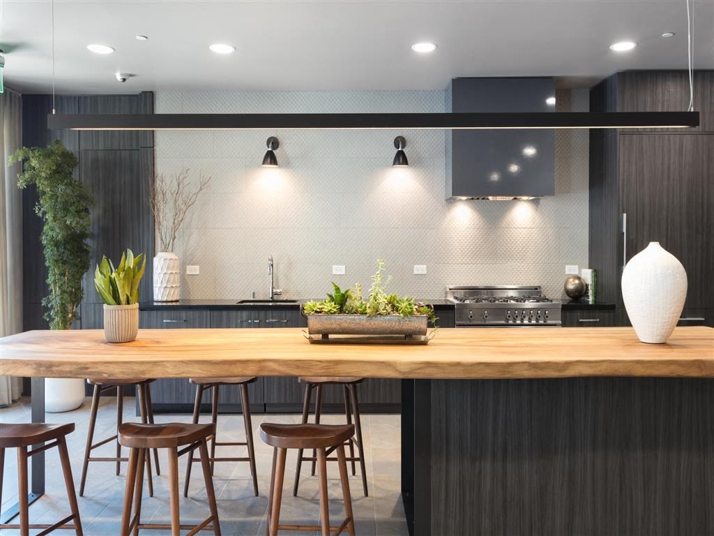 a kitchen with a wooden counter top and a table
