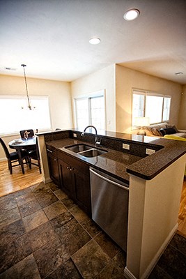 a kitchen with a sink and a counter top