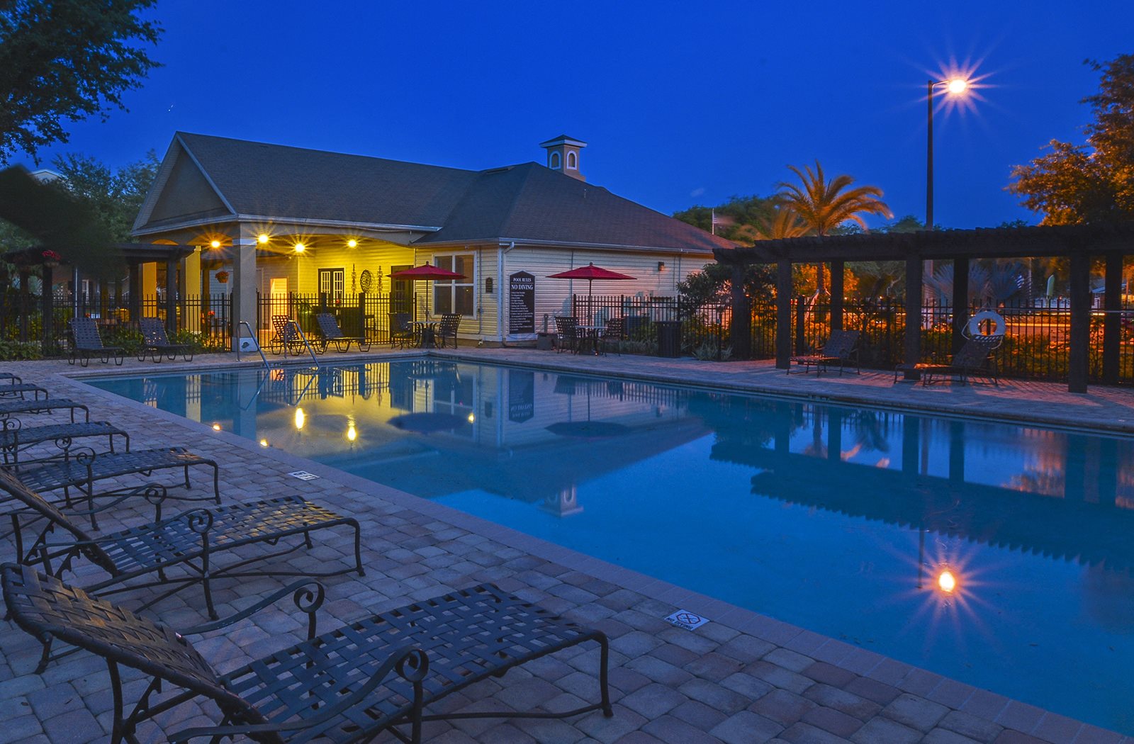 Carrington At Four Corners Apartments In Clermont Fl Outdoor Pool And Sundeck At Night