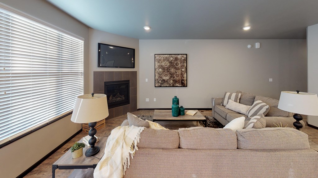 a living room with a couch and a fireplace