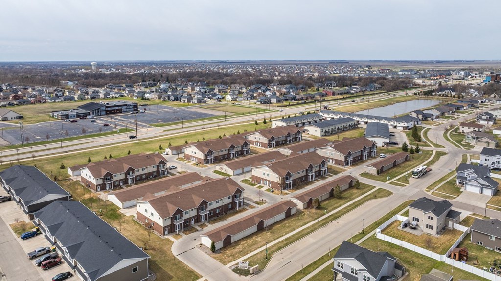 A suburban area with a mix of residential and commercial buildings.