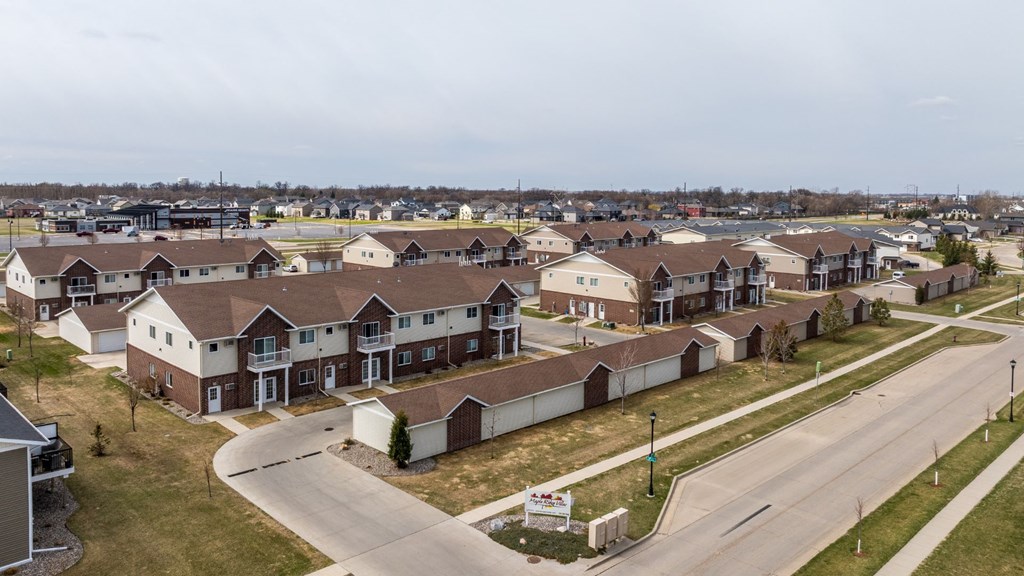 A suburban neighborhood with houses and a road.