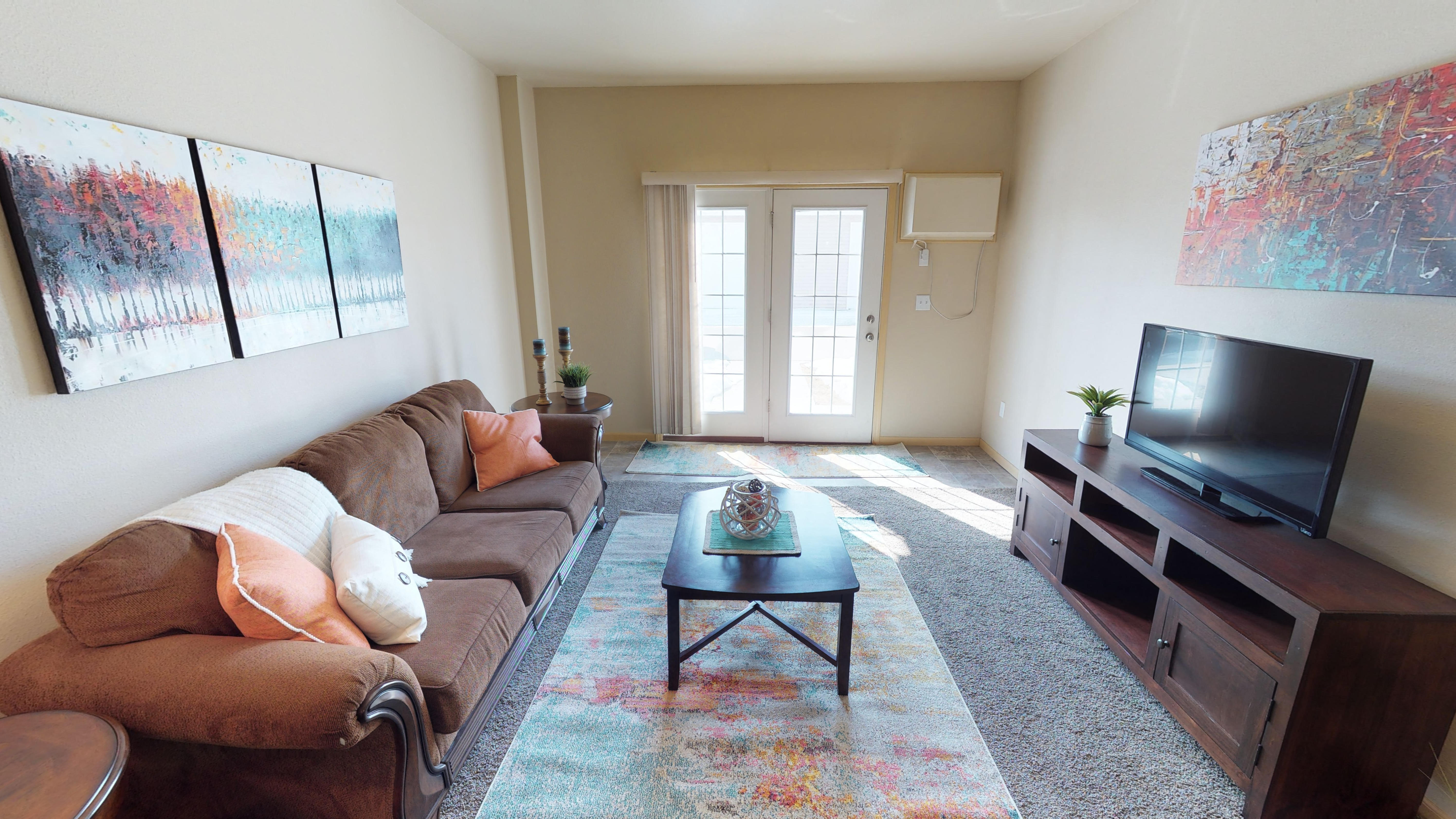 living room, furnished, patio door at Stonebridge Villas Apartments, Minot, North Dakota