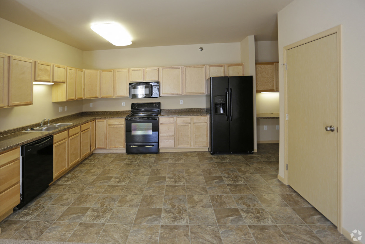 Kitchen with cabinets at Stonebridge Villas Apartments, Minot, ND, 58703