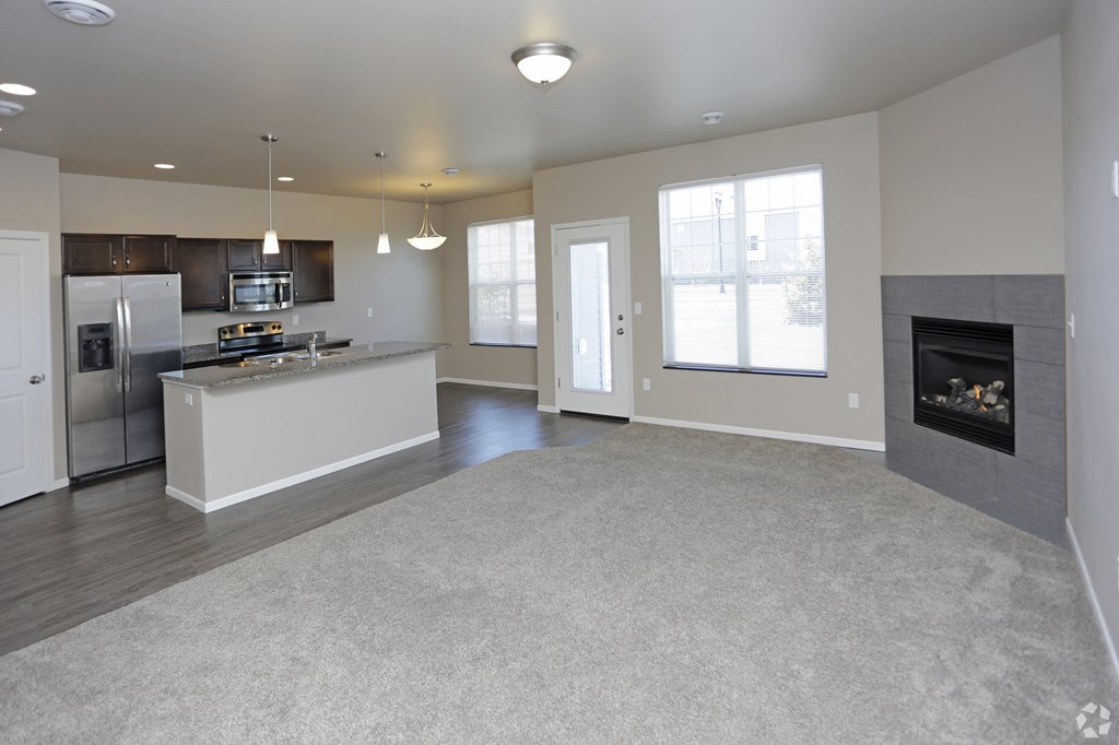 kitchen pantry, cabinets, counter, living room, gas fireplace