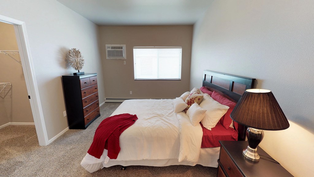 bedroom with dresser and bed