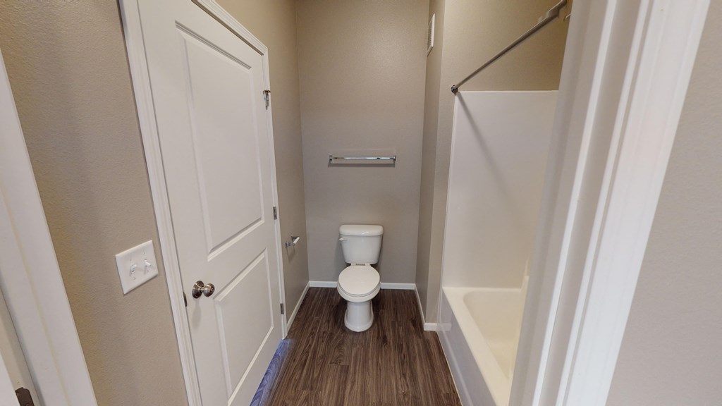 a small bathroom with a toilet and a shower