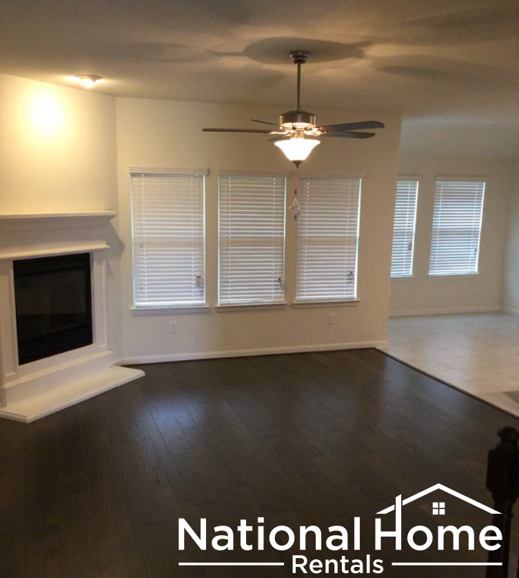 A National Home Rentals logo is displayed on a living room.