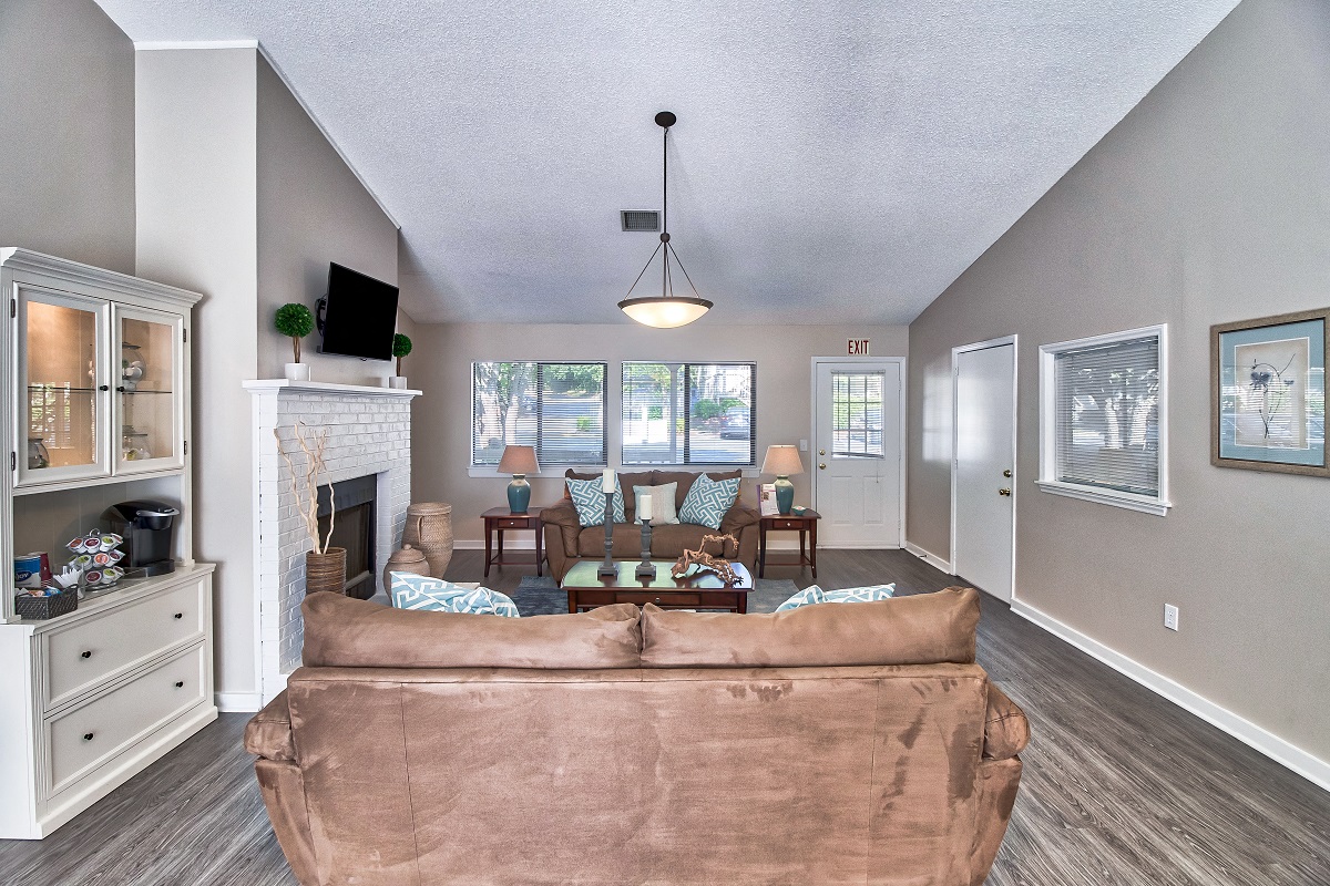 a living room with a couch and a fireplace