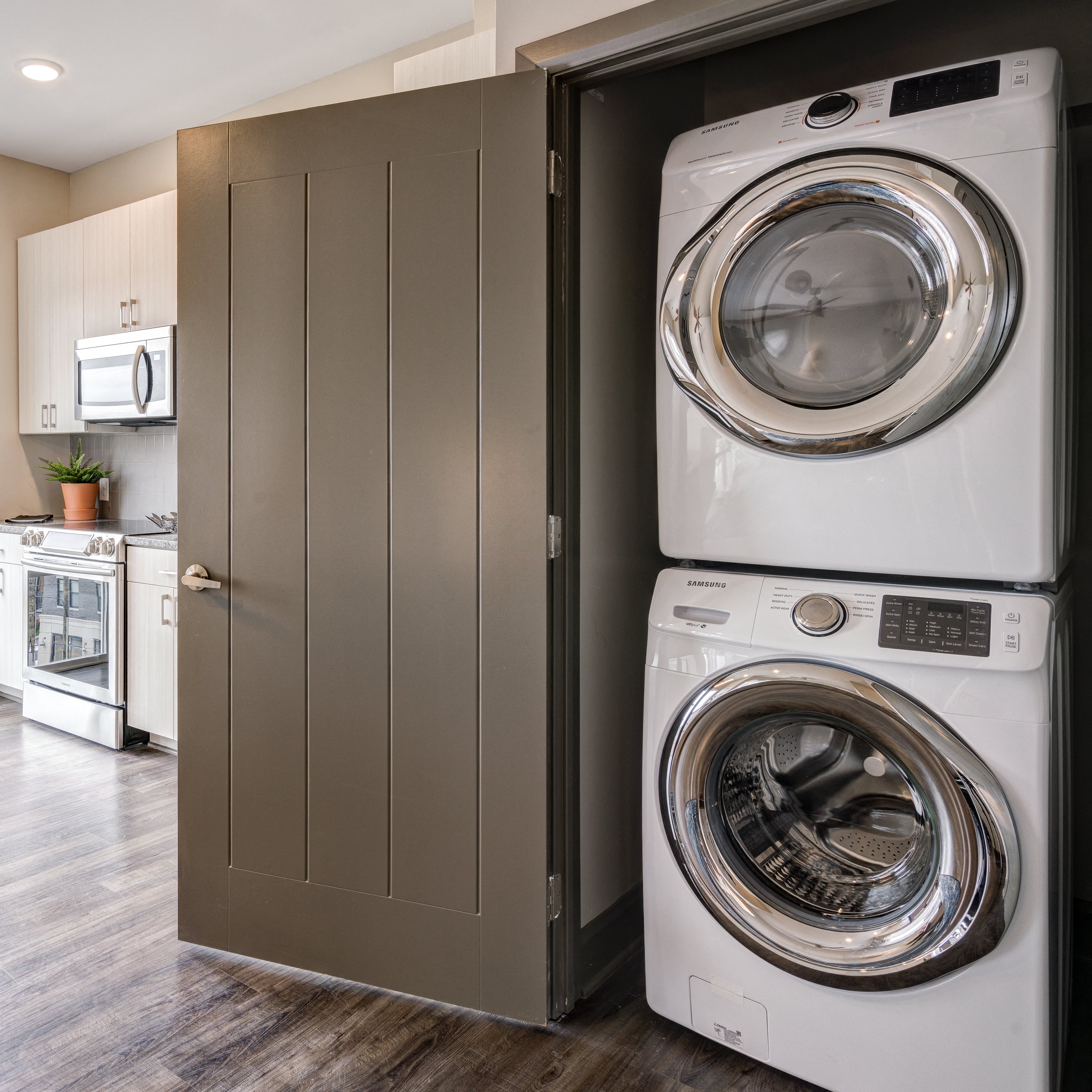 a front loading washer and dryer in a laundry room