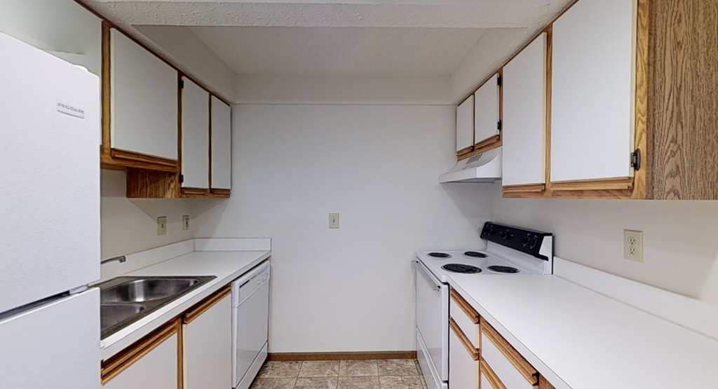Image of a kitchen with cabinets and appliances