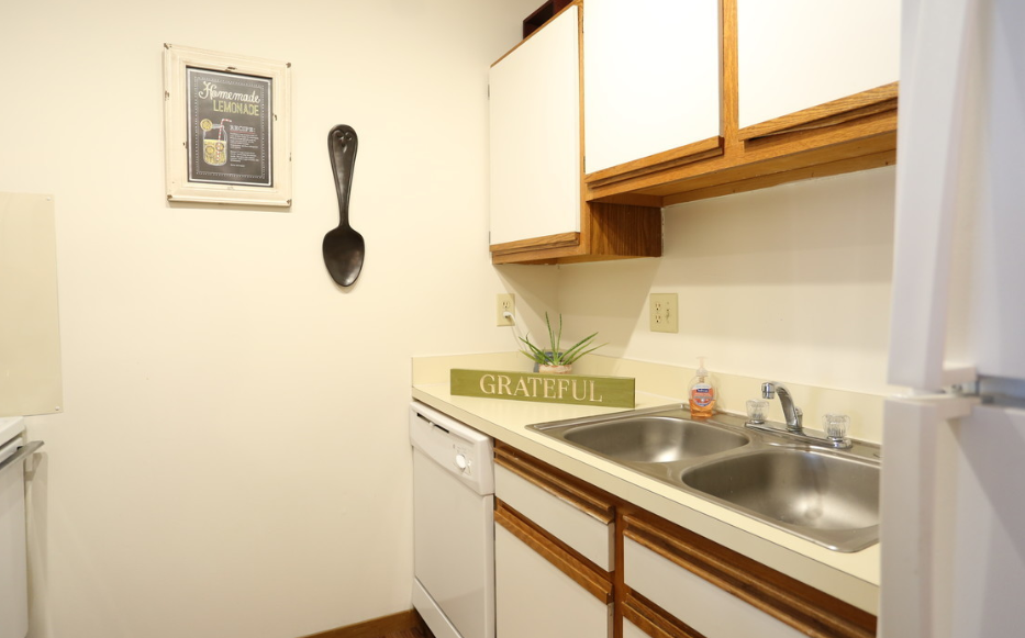 Image of kitchen with cabinets and sink