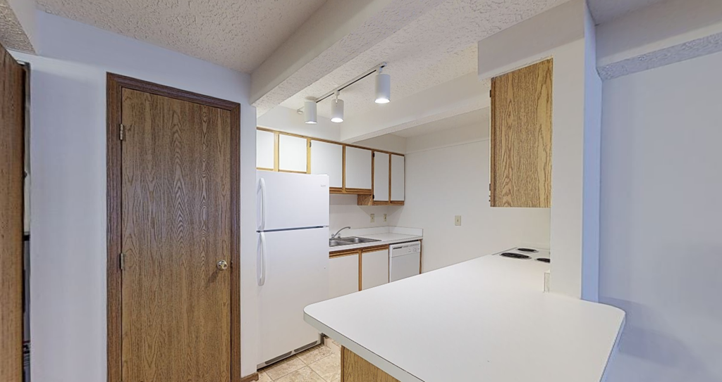 Image of kitchen with cabinets, island, and appliances