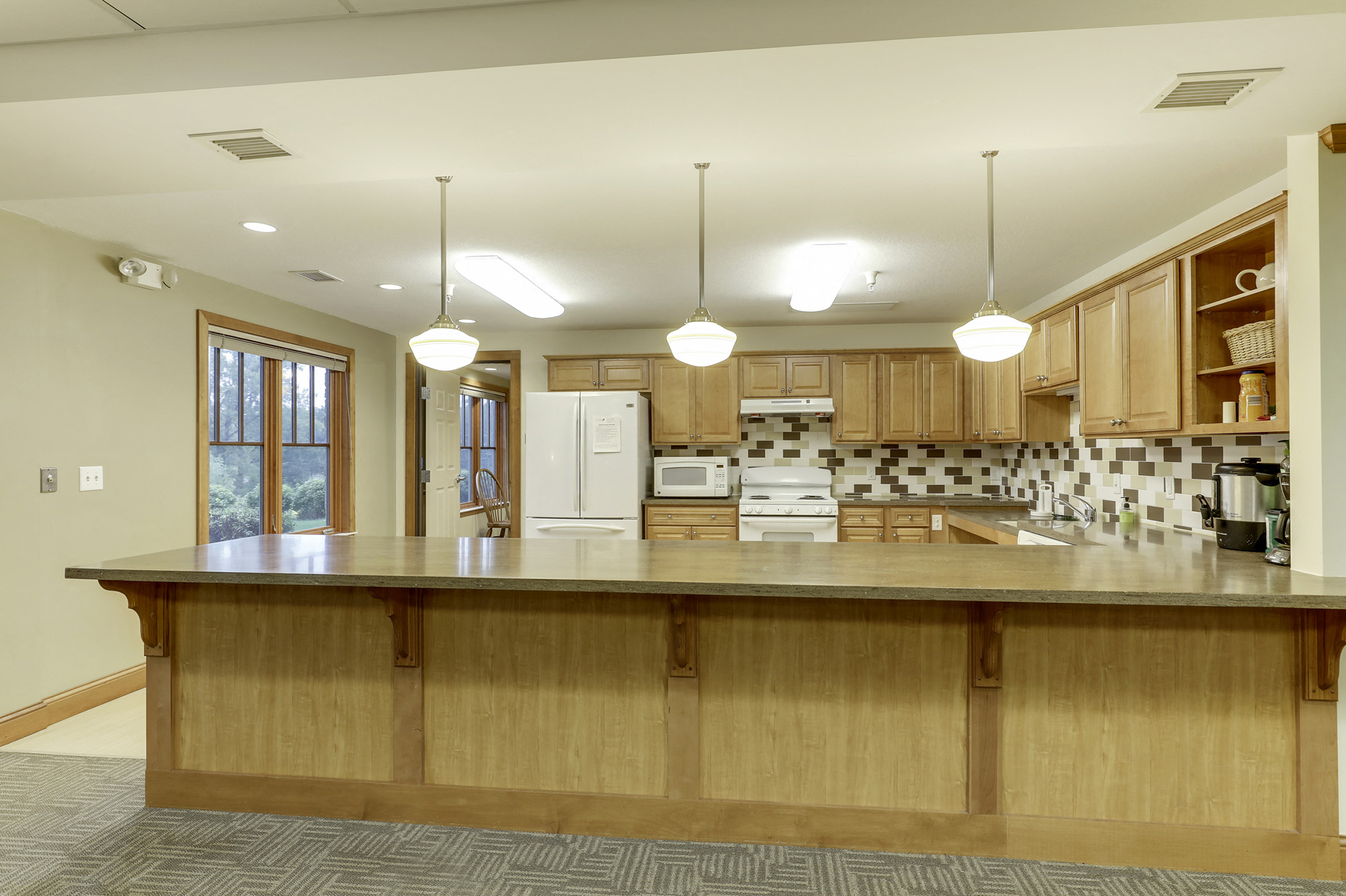 a large kitchen with a large counter top