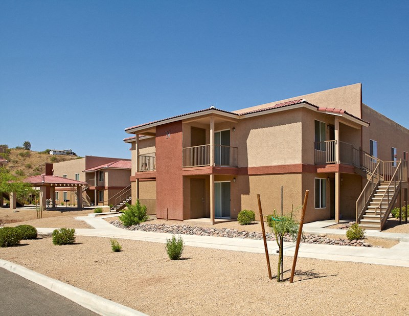 a building with a staircase and a street in front of it