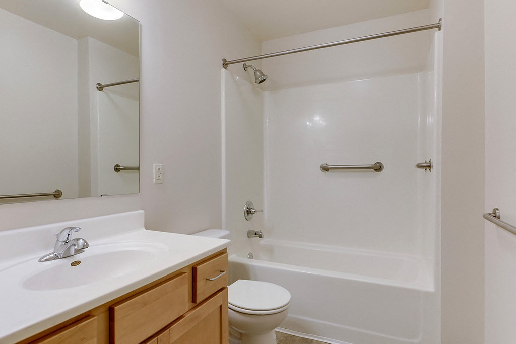 a bathroom with a sink toilet and a shower