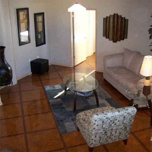 a living room with a couch and a glass table