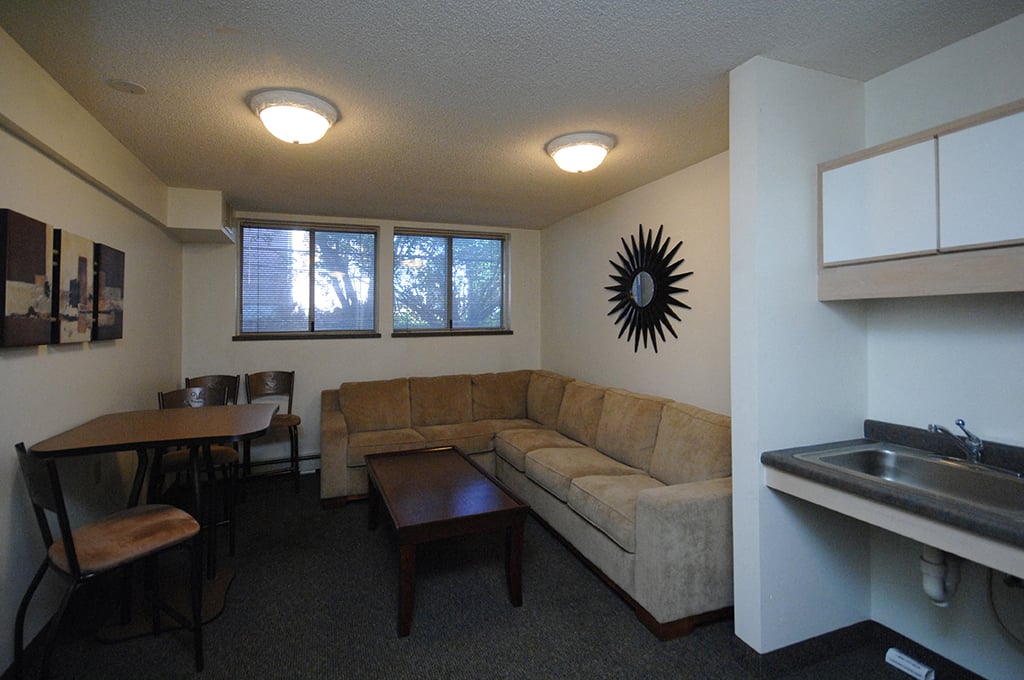 a living room with a couch and a table