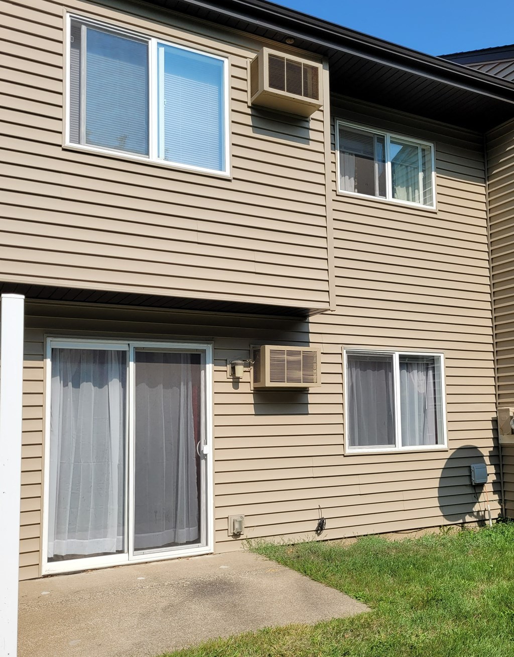 the side of a house with a sliding glass door