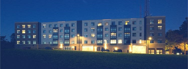 a large building with lights on in the night