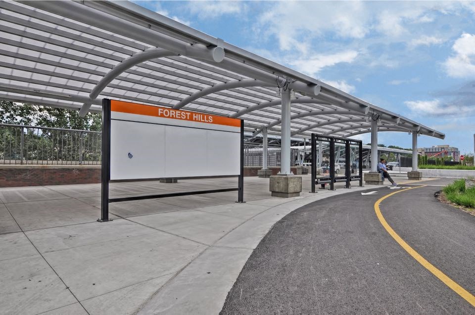 a bus stop on the side of a road