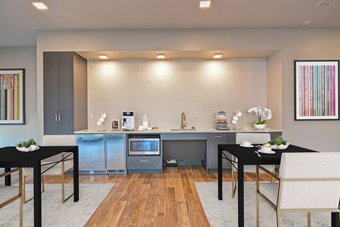 a small kitchen and dining room with a table and chairs