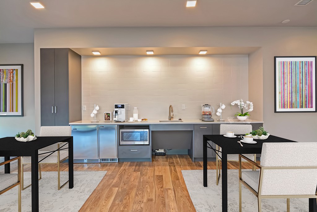 a small kitchen and dining room with a table and chairs