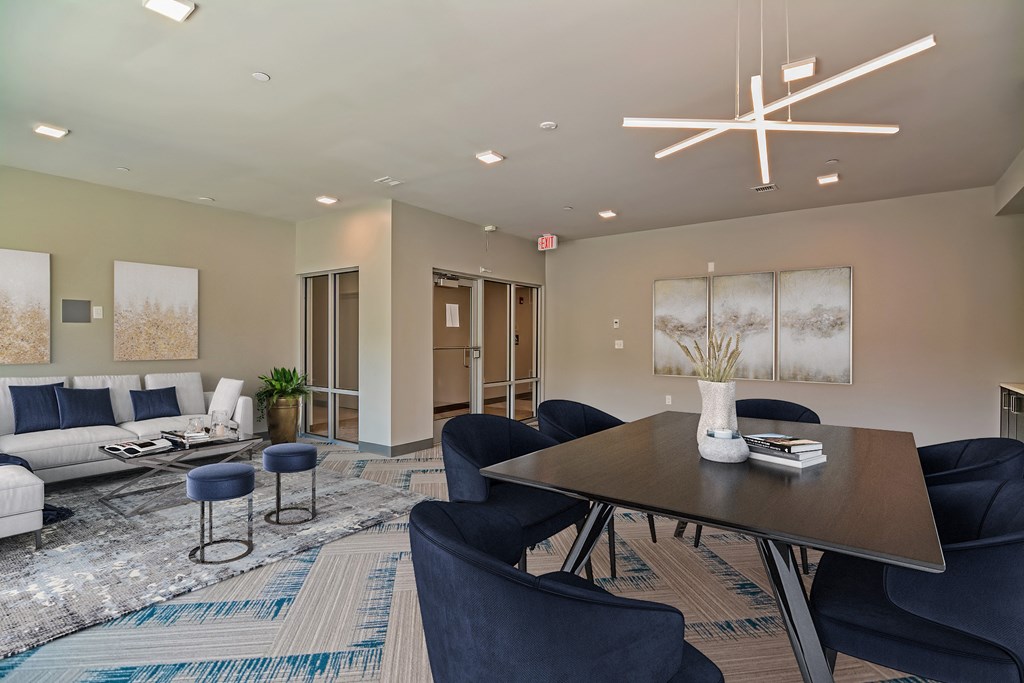 a living room with couches and chairs and a table