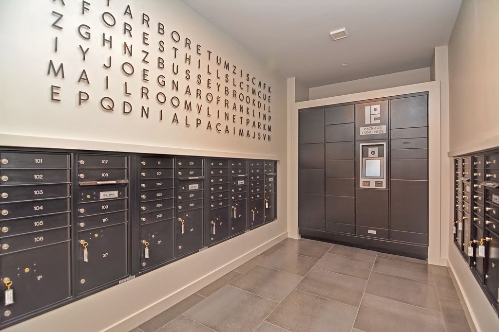 a locker room with lockers and a wall of alphabet letters