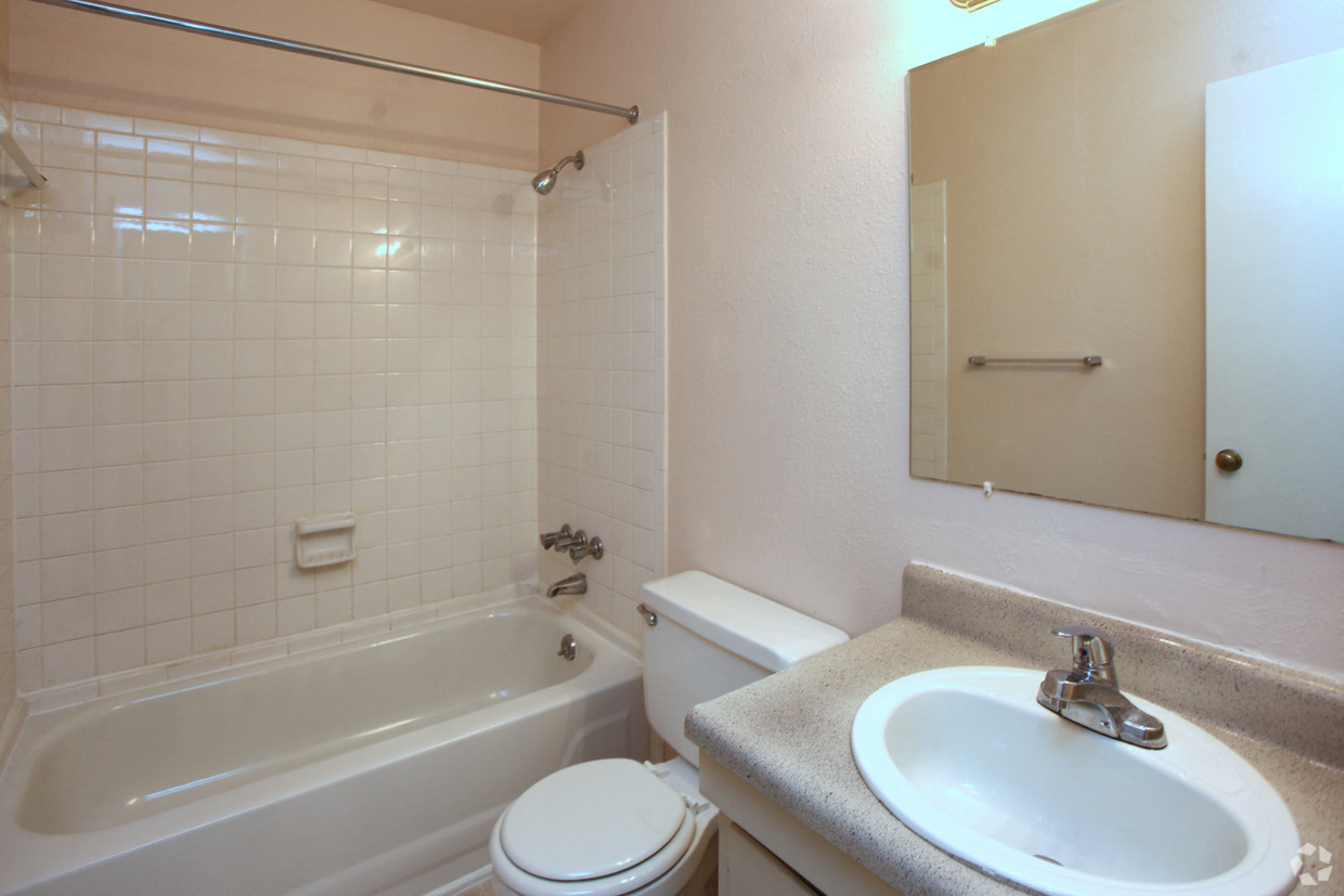 a bathroom with a sink toilet and a bath tub