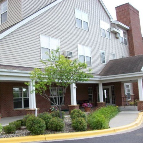 a house with a front porch and a sidewalk