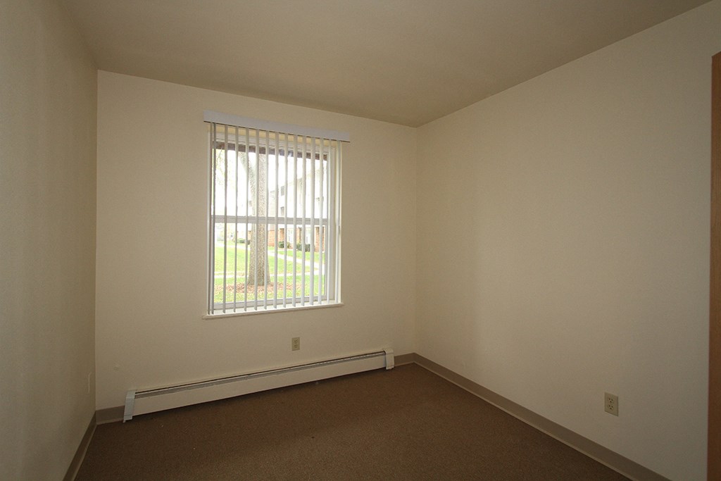 an empty room with a window in it