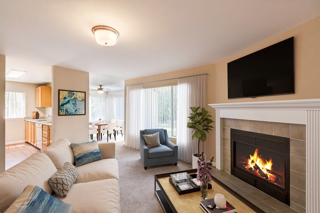 Living Room with fire on in the fireplace at Island Homestead