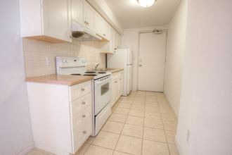a kitchen with a stove and a refrigerator