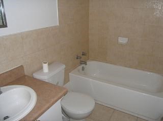 a bathroom with a sink toilet and a bath tub