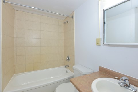 a bathroom with a sink toilet and a bath tub