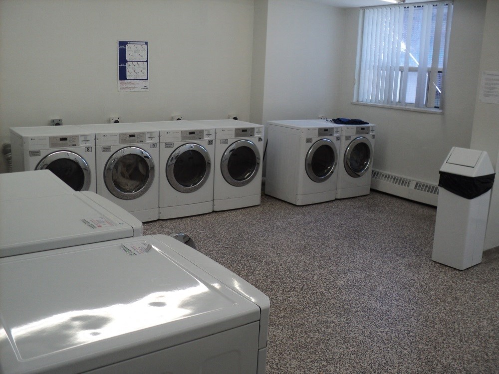 an image of a washer and dryer in a laundry room with a window