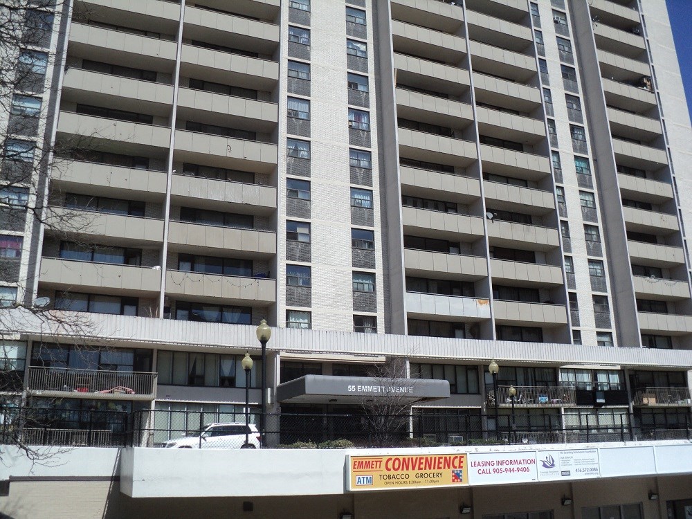 an apartment building with a construction sign in front of it