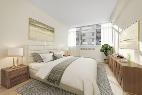 A bedroom with a large bed and a wooden nightstand.