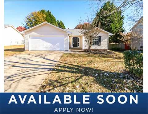 a white house with a yard and a white garage door