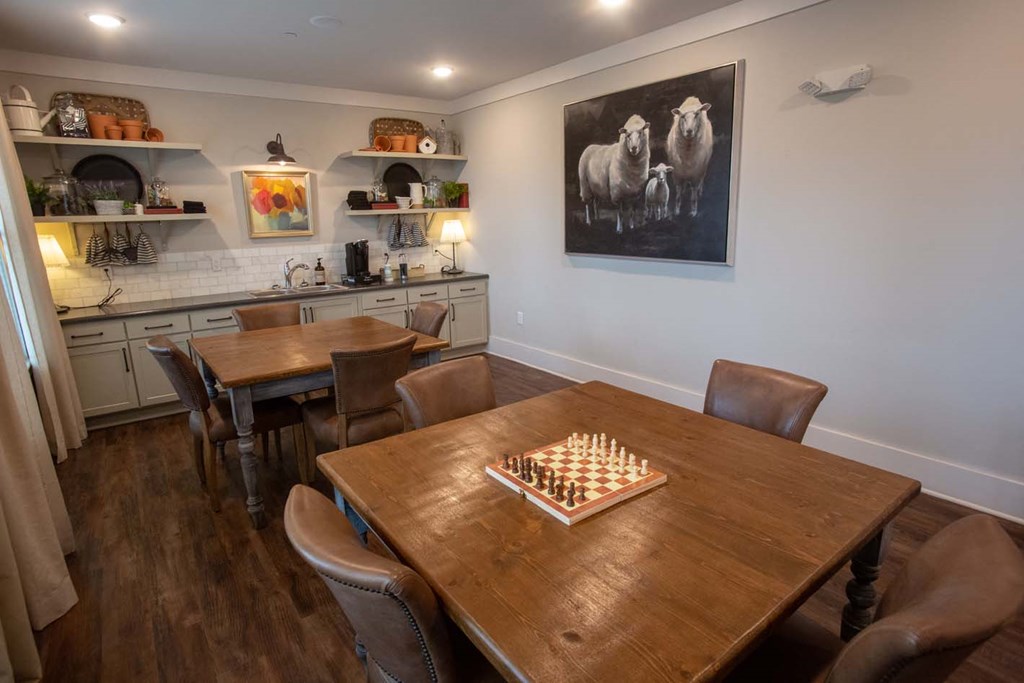 a dining room table with a chess board on it