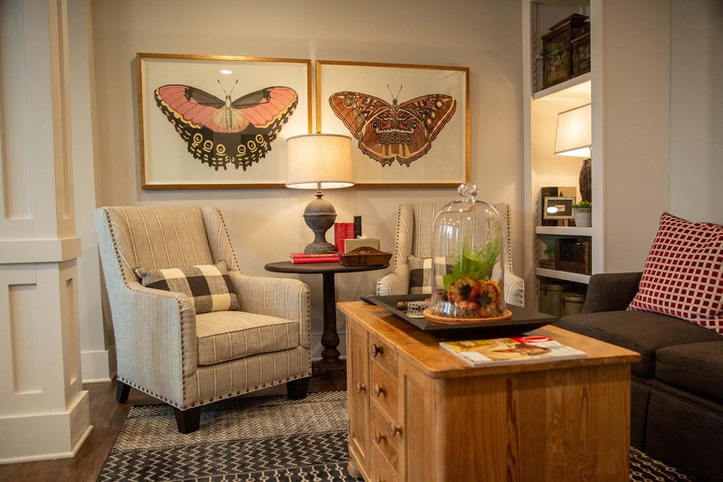 a living room with a chair and a table