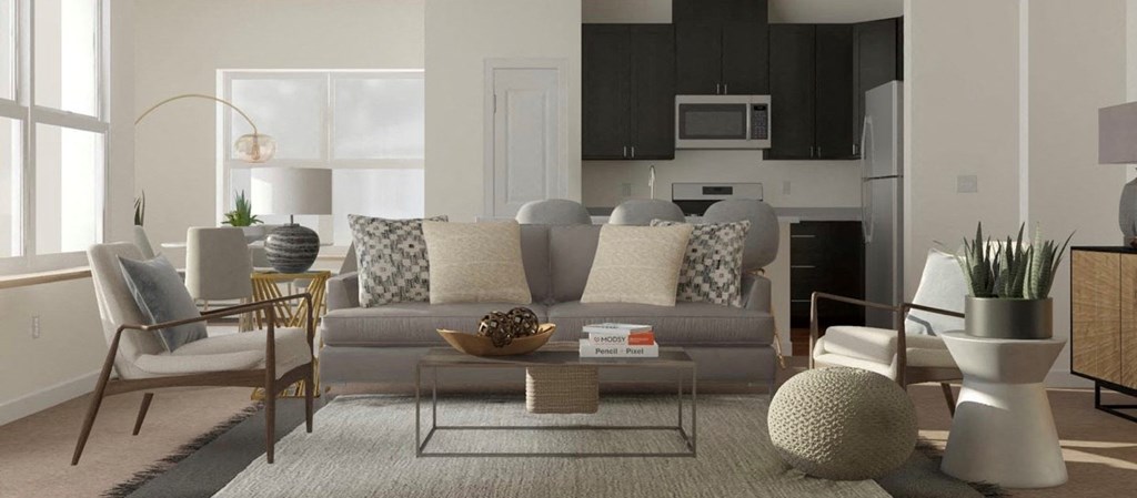 a living room with a couch and chairs and a table