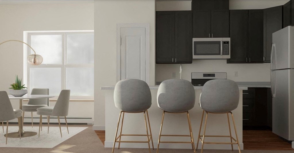 a kitchen and dining room with a table and chairs