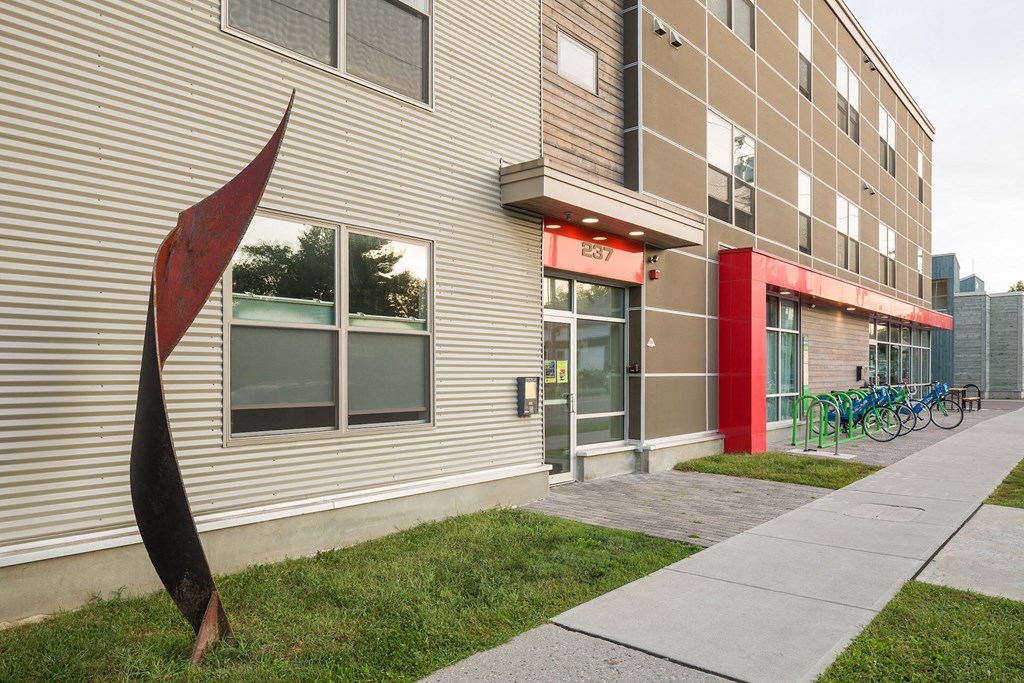 a sculpture of a flower in front of a building